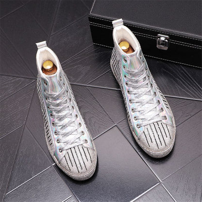 Pair of silver high-top sneakers with perforated design and white laces.