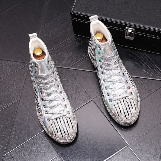 Pair of silver high-top sneakers with perforated design and white laces.