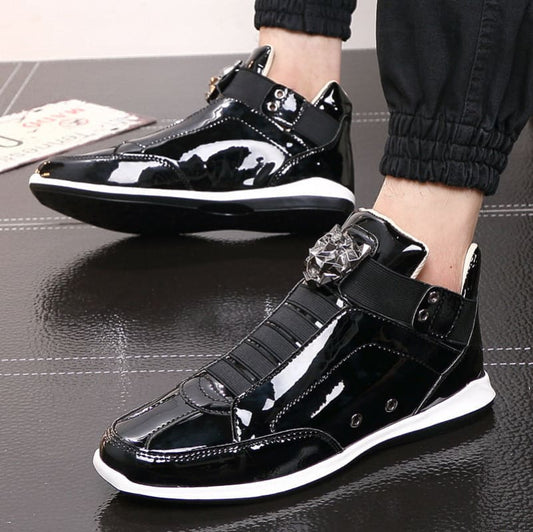 Glossy black high-top sneaker with metallic accents and white sole.