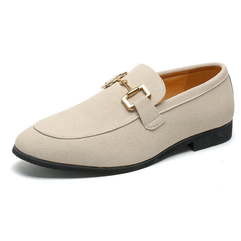 Beige suede loafer with gold metal buckle detail.