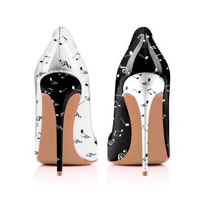 Pair of high-heeled shoes with musical note patterns in black and white.