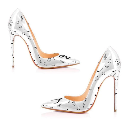 Pair of white high-heeled shoes with musical note patterns.