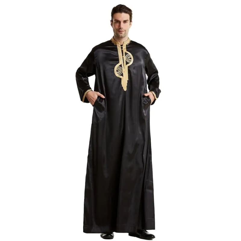 Long black robe with gold embroidery and a high collar.