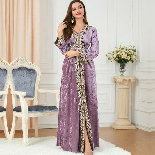 Lavender velvet kaftan with gold embroidery and long sleeves.