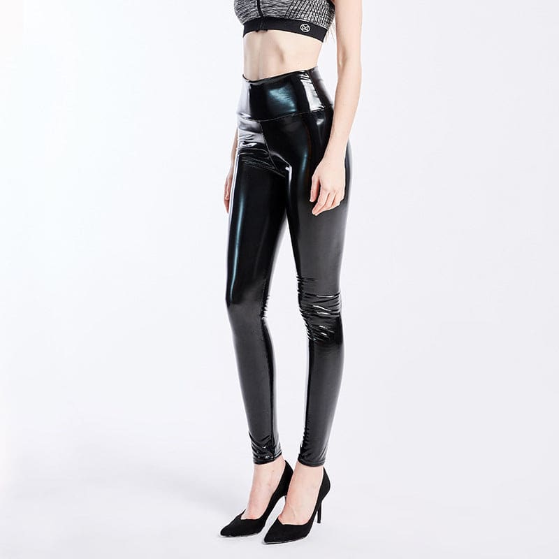 Shiny black latex or faux leather leggings worn with high heels.