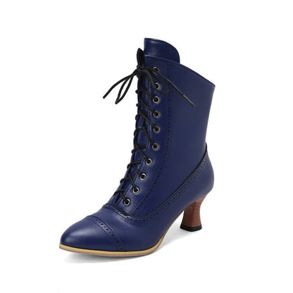 Navy blue Victorian-style lace-up ankle boot with a curved heel.