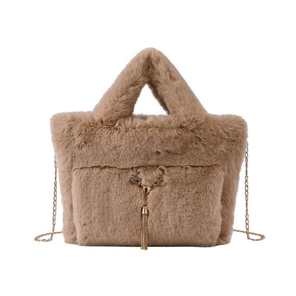 Fluffy beige handbag with fur-like texture and gold chain strap.