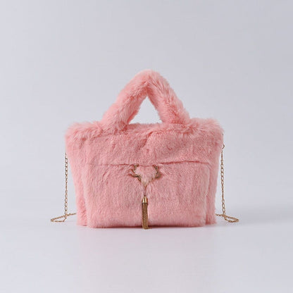 Pink fluffy handbag with a chain strap and zipper detail.