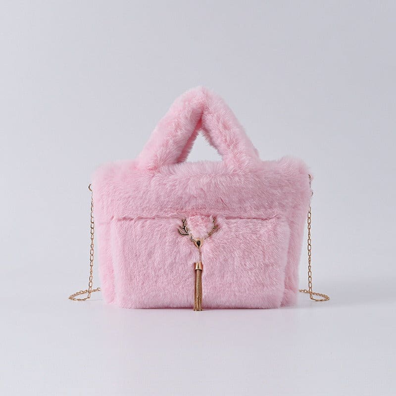 Pink fluffy handbag with a gold chain strap and tassel detail.