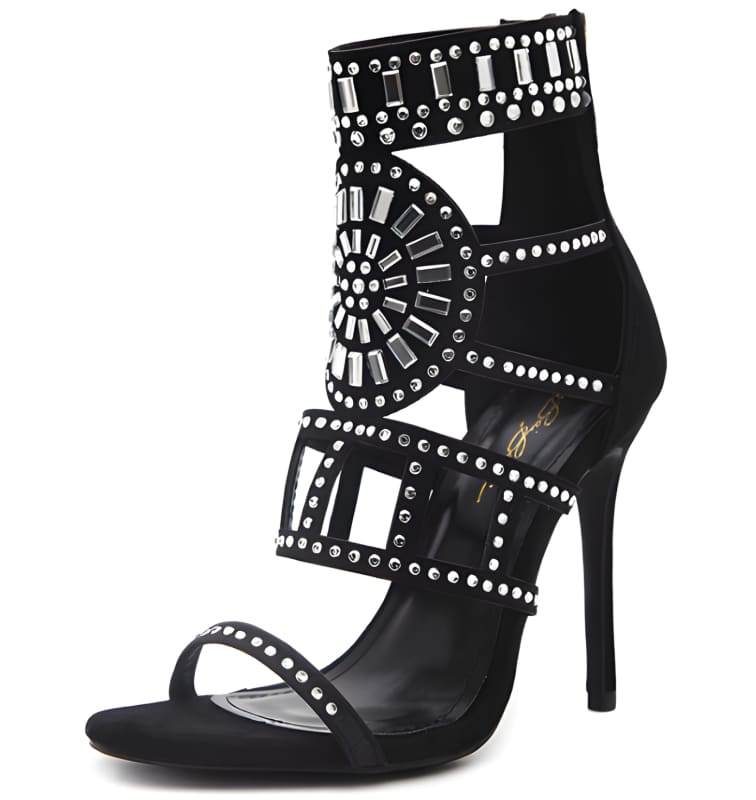 Ornate black high-heeled sandal with intricate silver stud detailing.