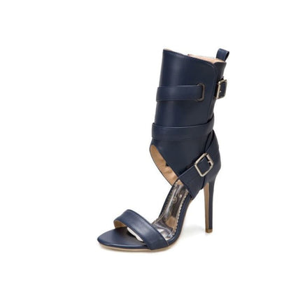 Navy blue high-heeled sandal with multiple straps and buckles.