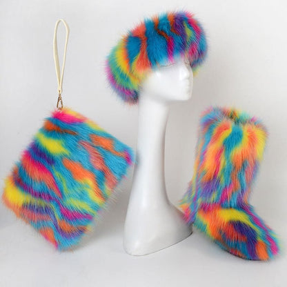 White mannequin head wearing a vibrant rainbow-colored faux fur hat, with matching furry boots and handbag displayed alongside.