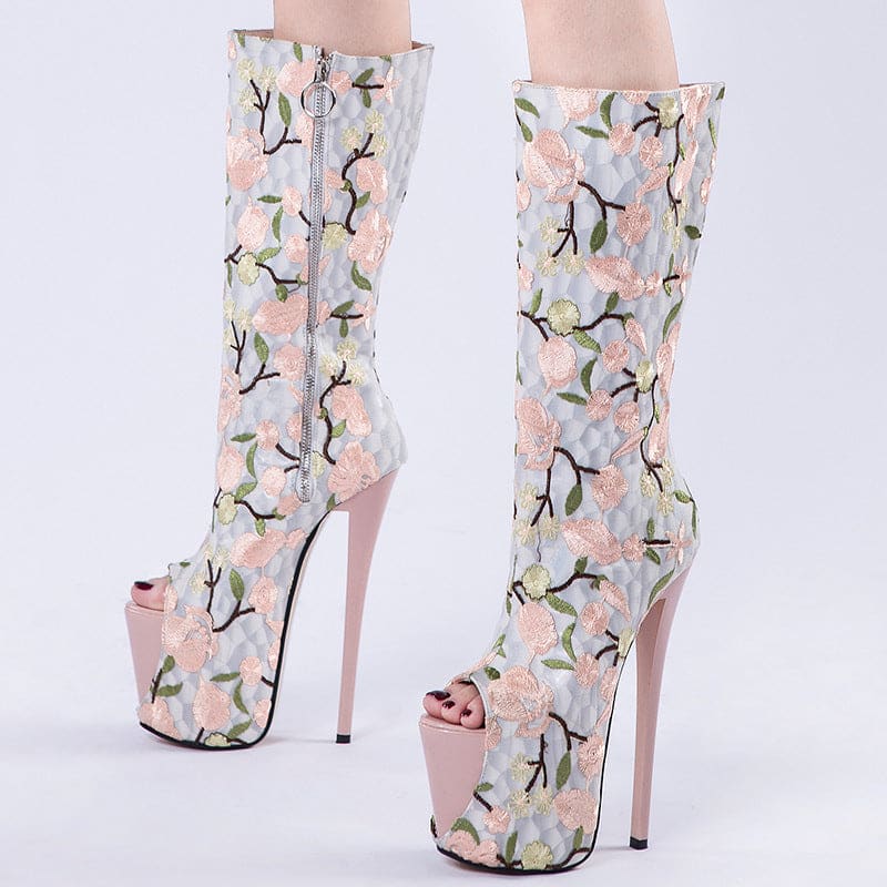 Floral-patterned high-heeled platform boots with peep toes.