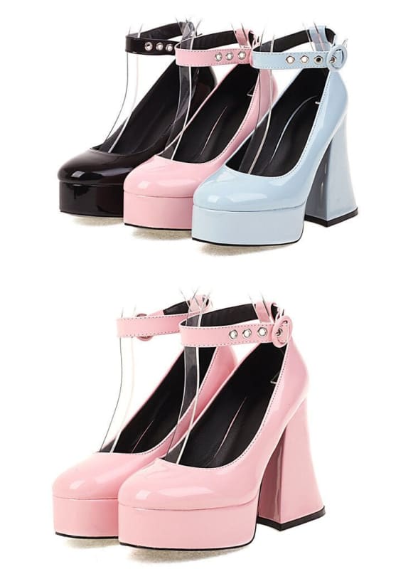 Platform high heels with ankle straps in black, pink, and light blue colors.