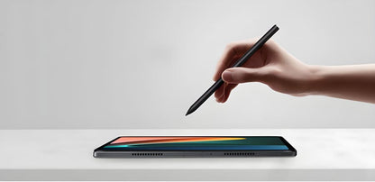 Tablet computer with a stylus hovering above its screen.