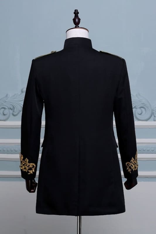 Black tailored jacket with ornate gold embroidery on the cuffs.