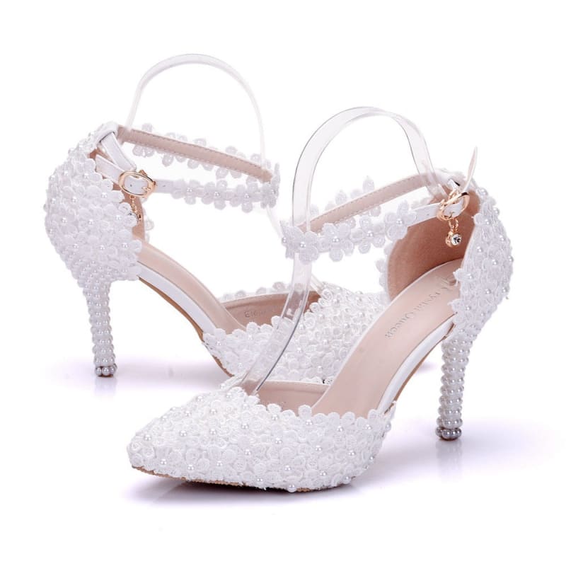 White lace sandals with ankle straps, perfect pointed toe high stiletto wedding shoes.