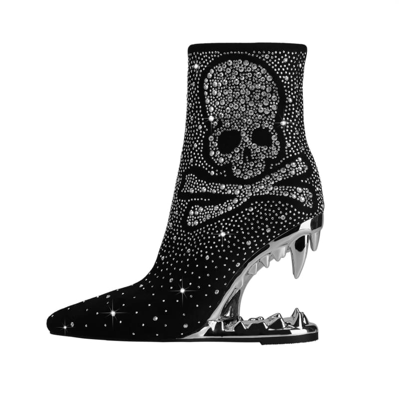 Sparkly black ankle boot with a skull design and shark-tooth shaped heel.