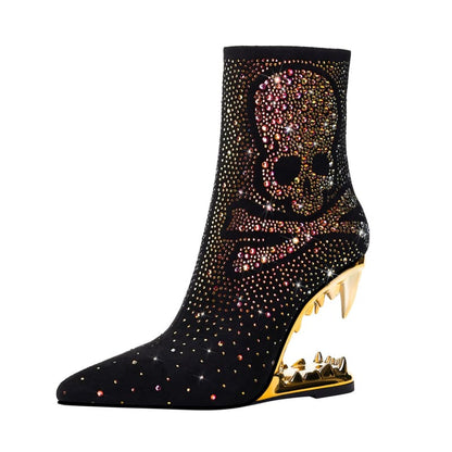 Ornate black ankle boot with a skull design made of colorful rhinestones and a unique gold heel.