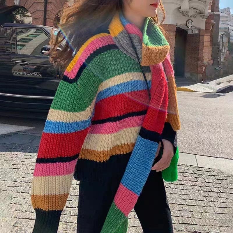 Colorful striped knit sweater with wide ribbing and a chunky texture.