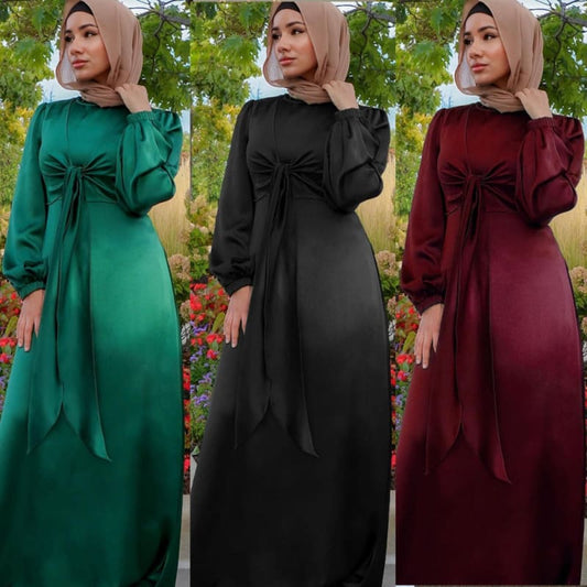 Long-sleeved maxi dresses with bow details in green, black, and burgundy colors.