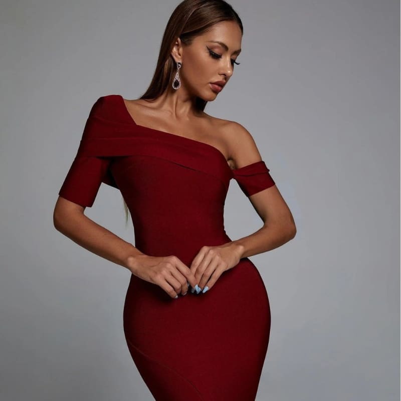 Form-fitting, off-shoulder red dress with short sleeves.