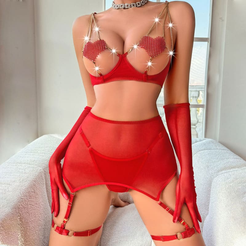 Provocative red lingerie set with heart-shaped pasties, garter belt, and long gloves.