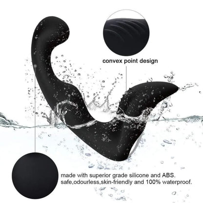 Black silicone sex toy with a curved shape splashing in water.