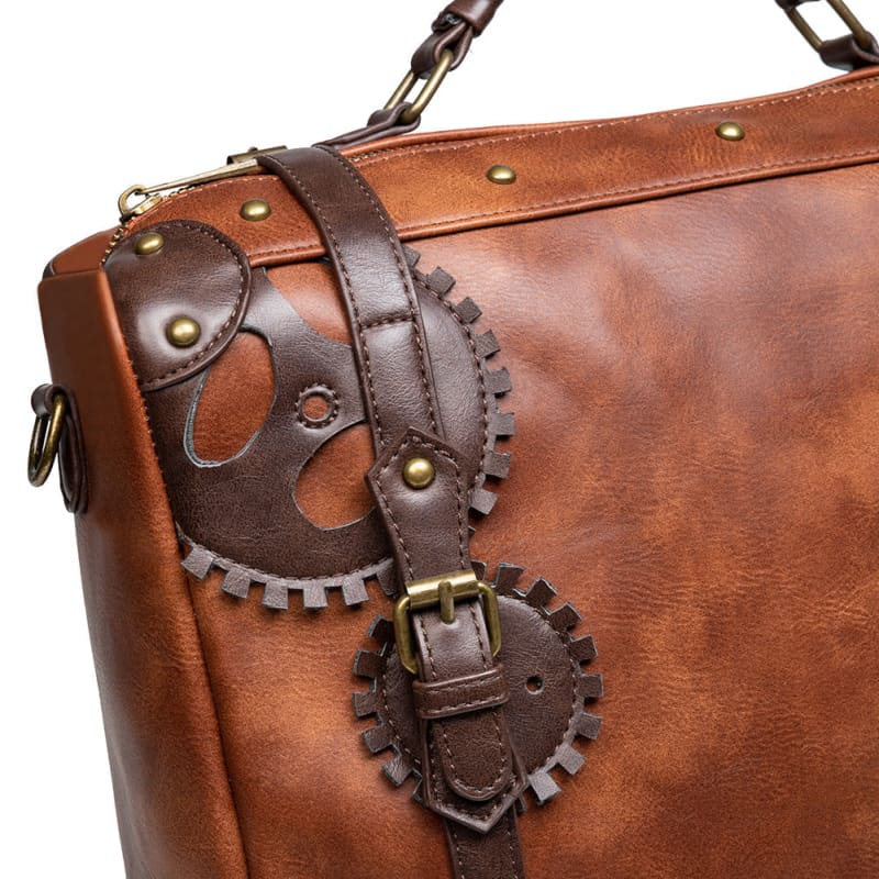 Brown leather briefcase with decorative gear-shaped embellishments and brass hardware.