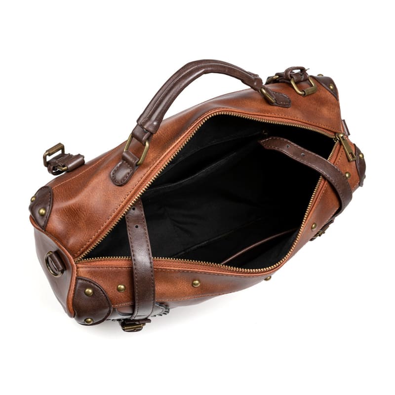 Brown leather handbag with an open top zipper showing the interior.