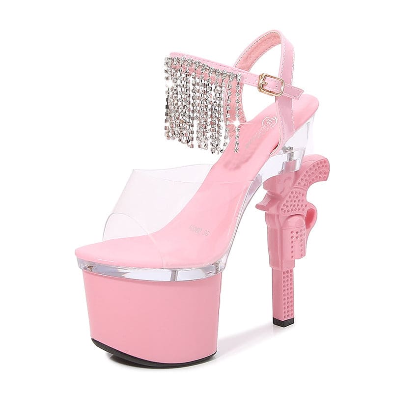 Pink platform high heel shoe with crystal fringe and a gun-shaped heel.