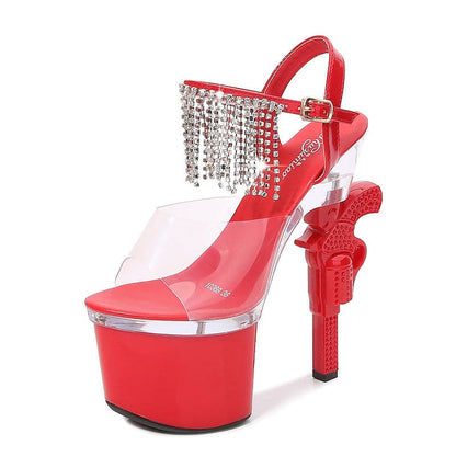 Red high-heeled platform sandal with rhinestone fringe and a gun-shaped heel.