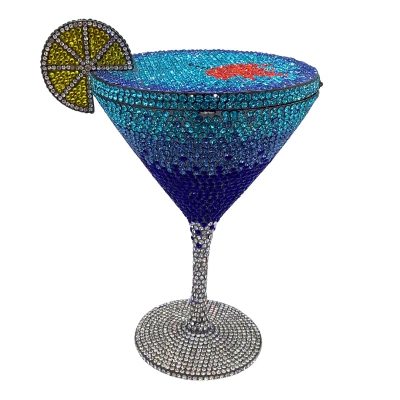 Bejeweled cocktail glass with a lime slice garnish.