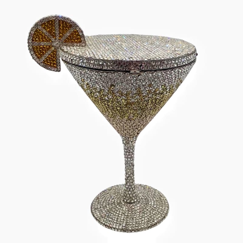 Bejeweled martini glass-shaped clutch purse with a decorative citrus slice.