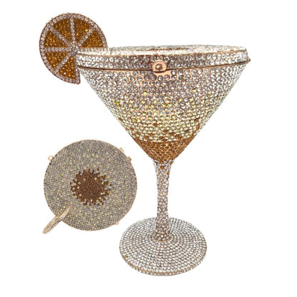 Bejeweled martini glass with a decorative citrus slice garnish.