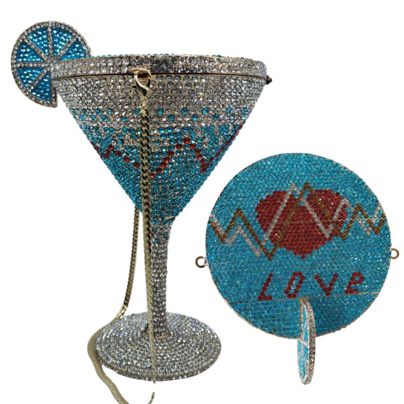 Bejeweled martini glass-shaped handbag with a decorative blue slice and accompanying circular ’Love’ charm.