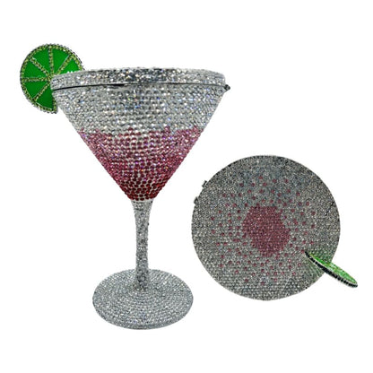 Glittery martini glass adorned with a decorative lime slice.