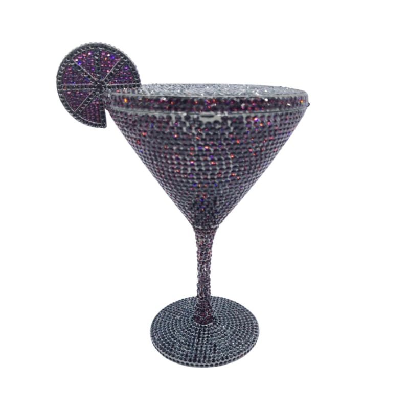 Bejeweled martini glass with a decorative slice garnish.