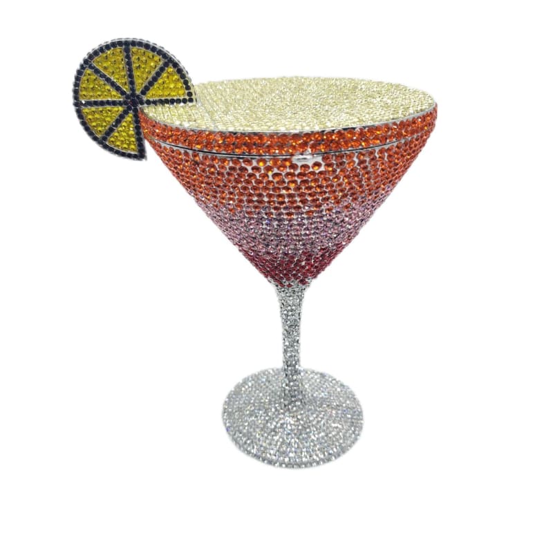 Bejeweled martini glass with a decorative lemon slice garnish.