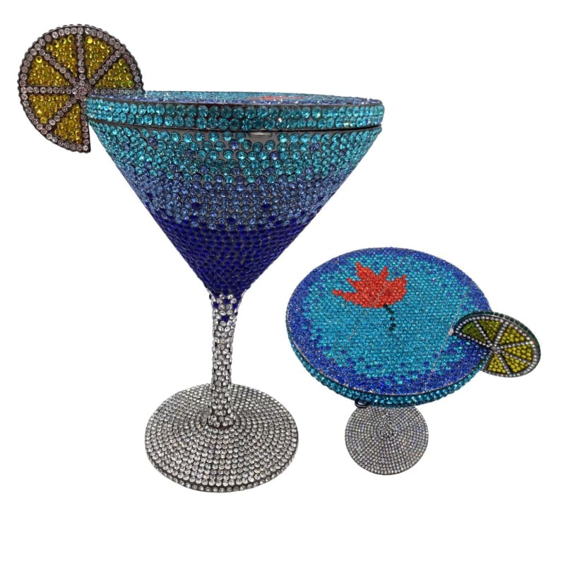 Bejeweled cocktail glass with a decorative lime slice garnish.