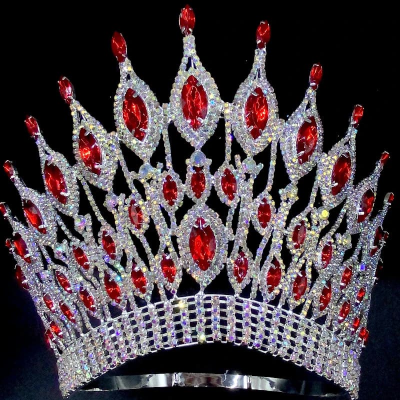 Ornate silver wedding crown tiara with red gemstones and crystal embellishments.