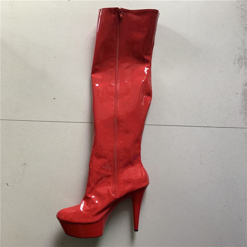 Red patent leather knee-high platform boot with a stiletto heel.