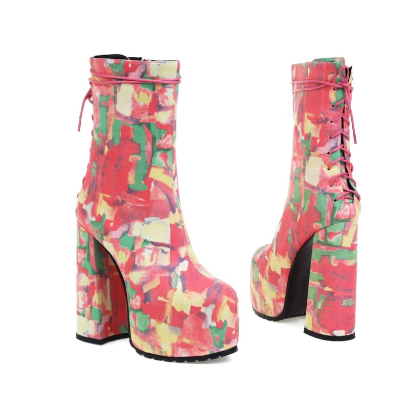 Pair of colorful platform ankle boots with a chunky heel and abstract pattern.