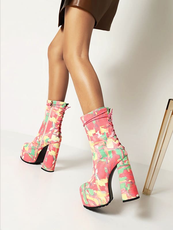 Colorful platform ankle boots with a floral pattern and chunky heels.