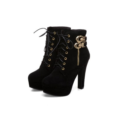 Black high-heeled ankle boots with laces and decorative gold buckles.