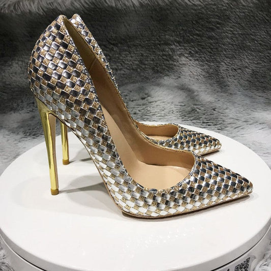 Pair of glittery, high-heeled stiletto pumps with a textured diamond pattern.