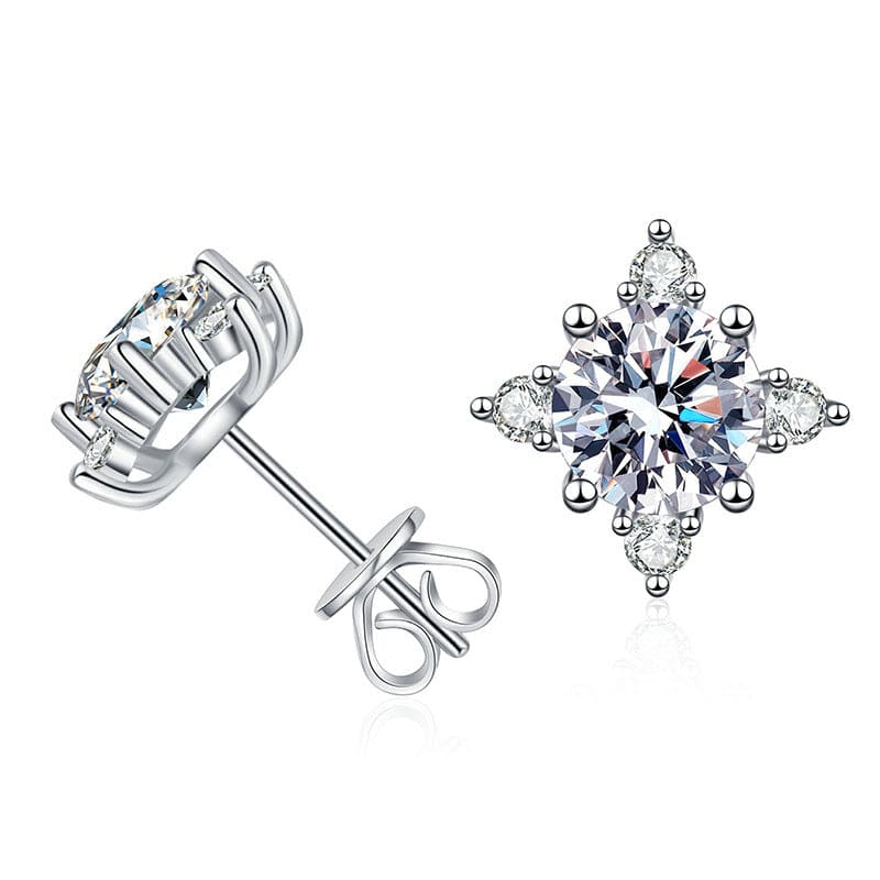 Pair of diamond-like stud earrings in a snowflake or star shape.