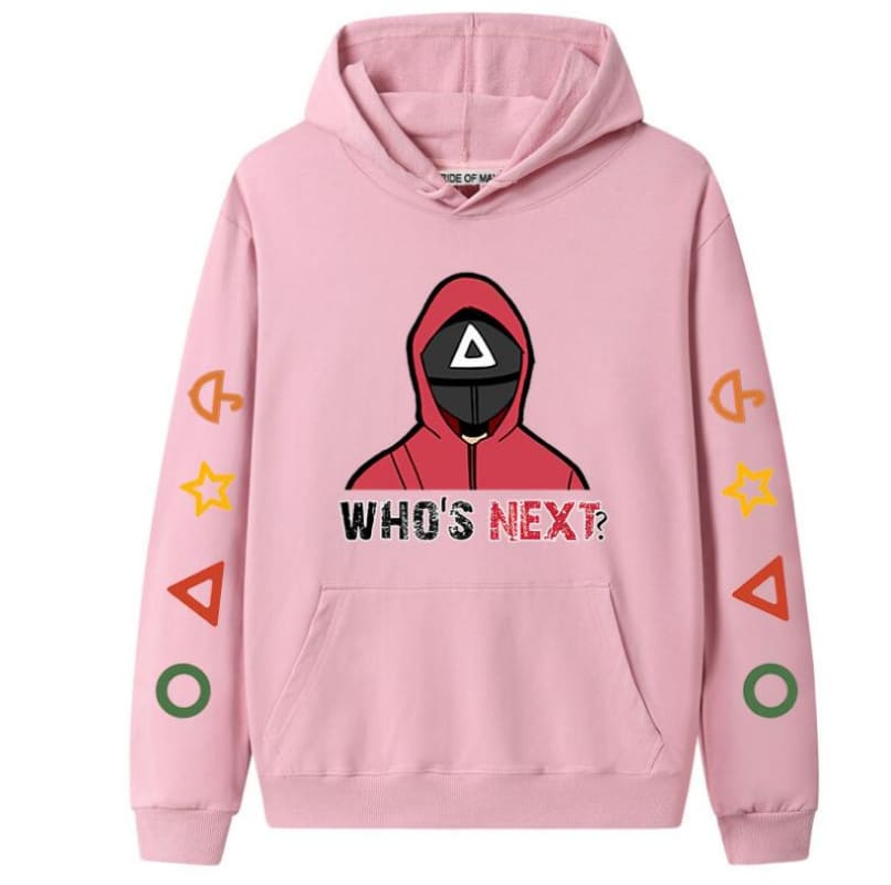 Pink hoodie featuring a graphic design of a hooded figure and the text ’WHO’S NEXT?’ along with various shapes on the sleeves.