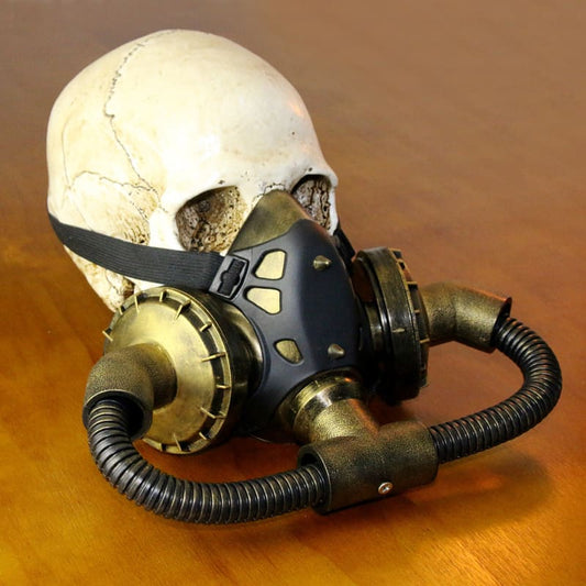 Human skull wearing a steampunk-style gas mask or respirator.