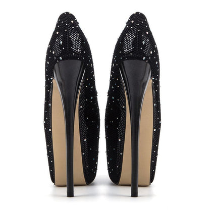 Pair of black glittery high-heeled platform shoes.